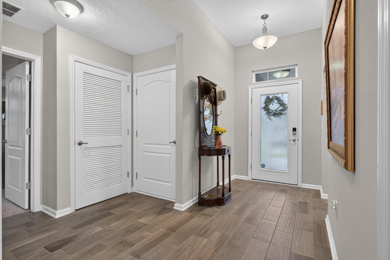 Foyer closet doors and front door at 4319 Green River Pl, Middleburg, FL 32068