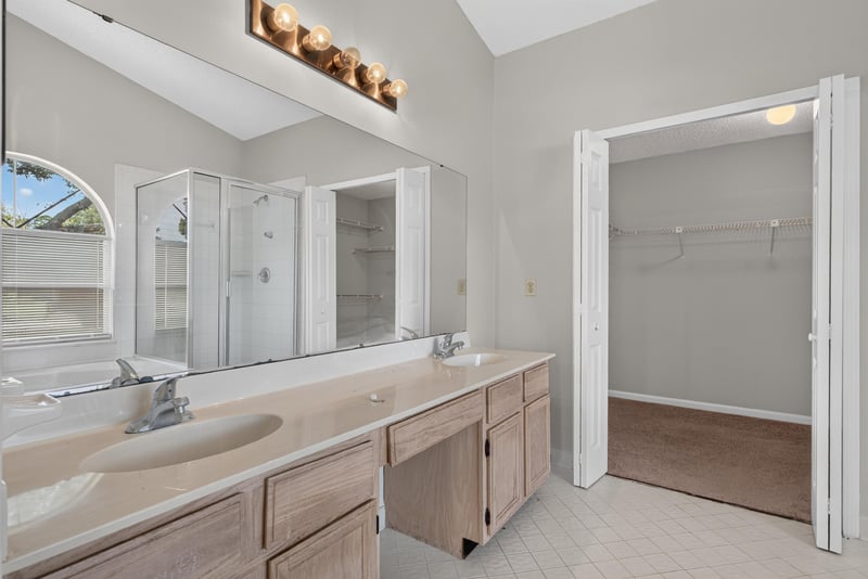 Primary bathroom vanity with mirror at 400 Ashcroft Landing Dr, Jacksonville, FL 32225