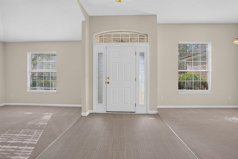 Foyer with front door and transom window at 299 John's Creek Pkwy, St. Augustine, FL 32092