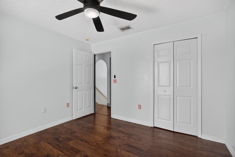 Bedroom with wood floor and closet doors at 3428 Glenn Hollow Ct, Jacksonville, FL 32226