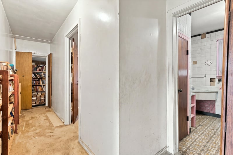 Hallway lined with bookshelves at 1807 Idlewild Ave, Green Cove Springs, FL
