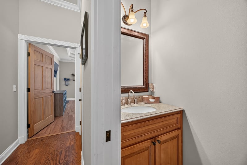 Hallway with vanity area and wood door at 1735 Hagans Ridge Ct