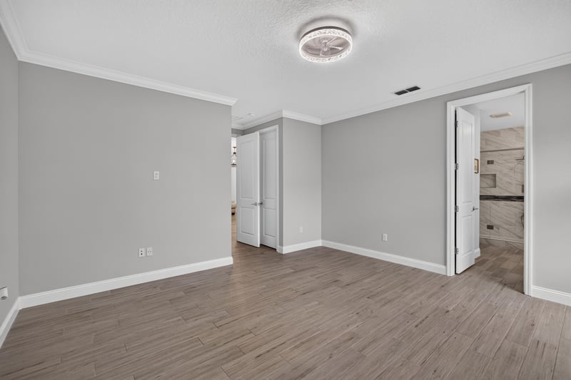 Primary bedroom with door to the en-suite bath at 91 Tilloo Ct, St. Johns, FL