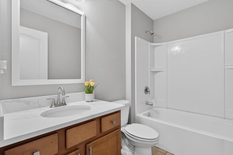 Bathroom vanity with mirror at 706 Grampian Highlands Dr, St. Johns, FL 32259