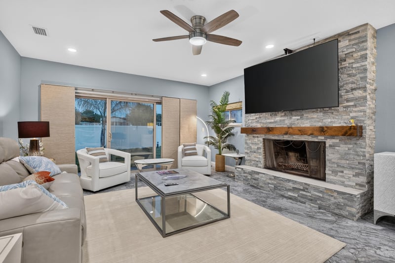 Living room with large windows and seating at 1525 8th St N, Jacksonville Beach, FL