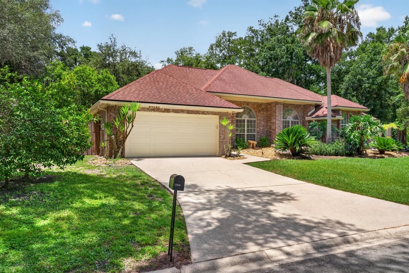 Front exterior garage and driveway at 12810 Swamp Owl Ln