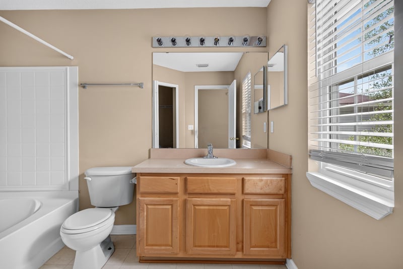 Bathroom with tub-shower combo and vanity at 12359 Mangrove Forest Ct, Jacksonville, FL 32218