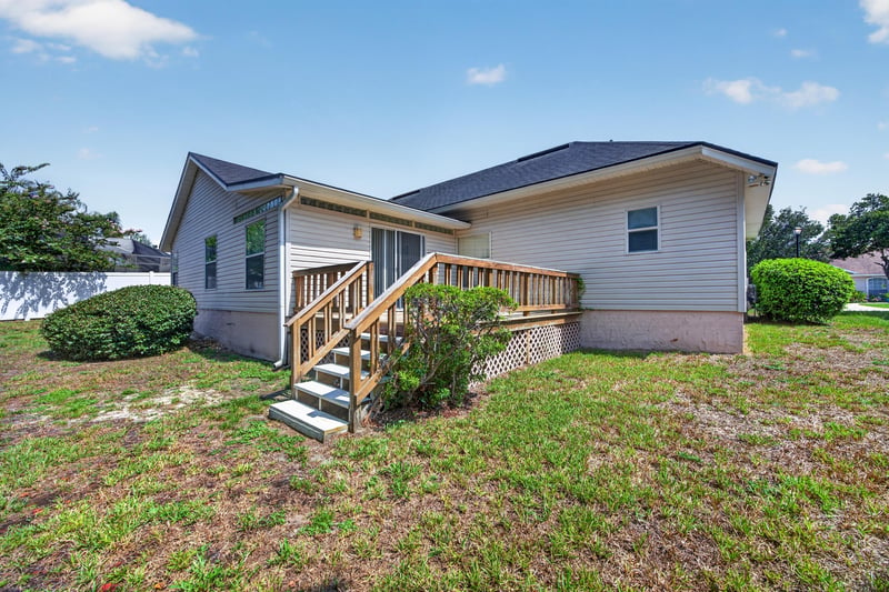 Rear exterior with deck and stairs at 9256 Dale View Ln W, Jacksonville, FL 32225