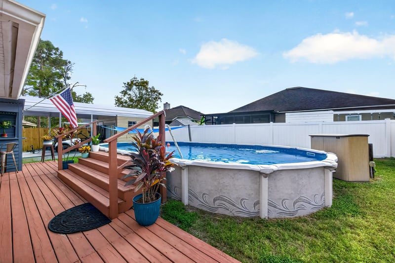 Above-ground pool and deck stairs at 3112 Silverado Cir, Green Cove Springs, FL 32043