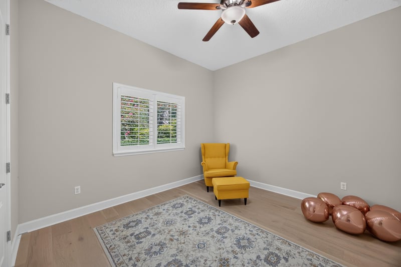 Bedroom with yellow accent chair at 276 Cross Ridge Dr, Ponte Vedra Beach, FL 32081