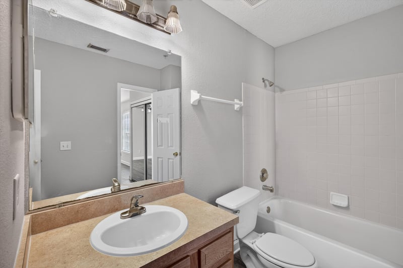 Bathroom with tub and shower combo at 1701 The Greens Way 1415, Jacksonville Beach, FL 32250