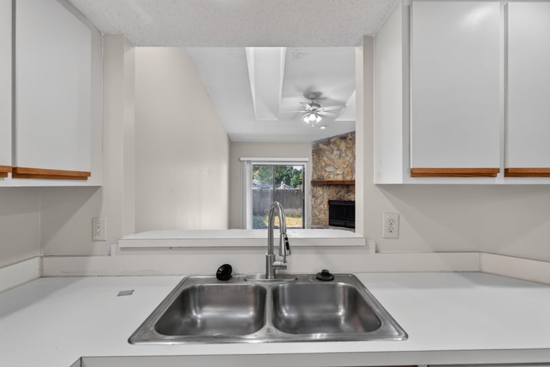 Kitchen sink with stainless double basin at 8010 International Village Dr, Jacksonville, FL 32277