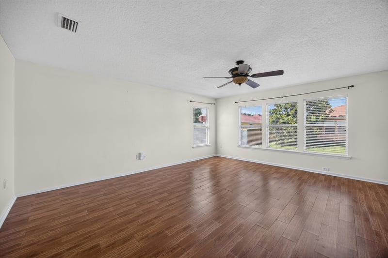 Empty family room with ceiling fan at 2282 Justin Lake Dr, Jacksonville, FL