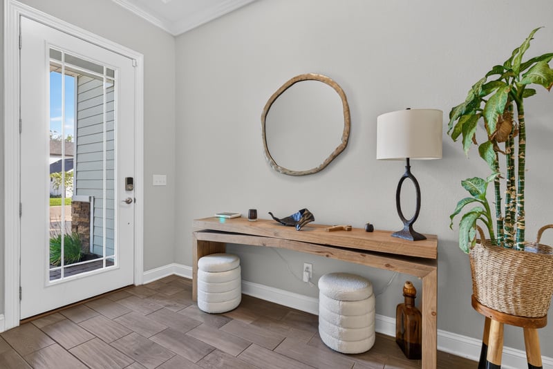 Entry area with console table and glass door at 3328 Southern Oaks Dr, Green Cove Springs, FL 32043