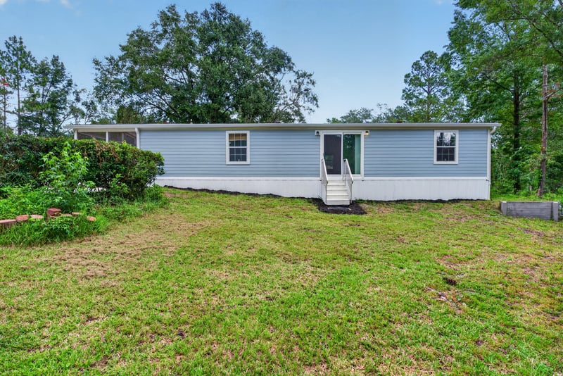 Front exterior view with screened porch at 4890 McAllister Rd, Middleburg, FL 32068