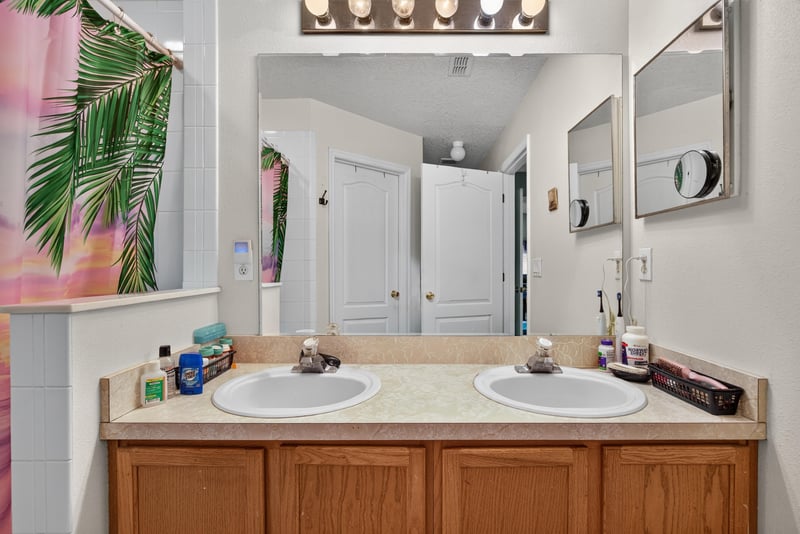 Bathroom with dual sinks and mirror at 145 Dover Bluff Dr, Orange Park, FL