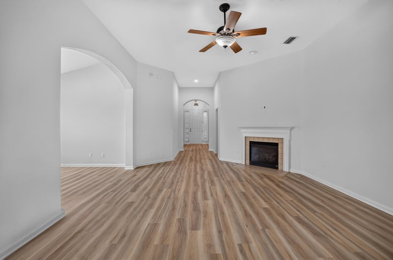 Living room wide view with fireplace and arched openings at 3101 E Banister Rd, St. Augustine, FL 32092