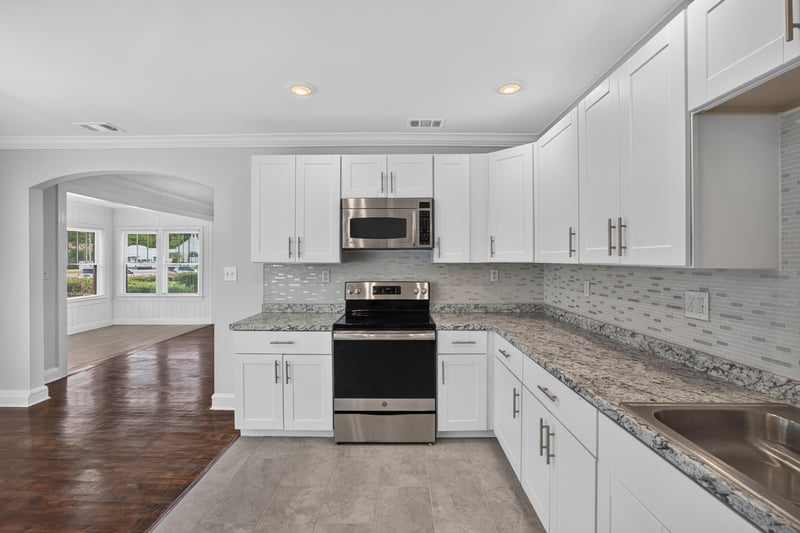 Kitchen view through arched opening to living room at 316 W 41st St, Jacksonville, FL 32206