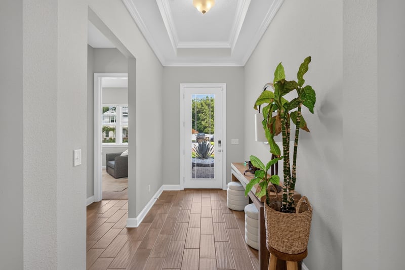 Foyer with sidelight door and tile flooring at 3328 Southern Oaks Dr, Green Cove Springs, FL 32043