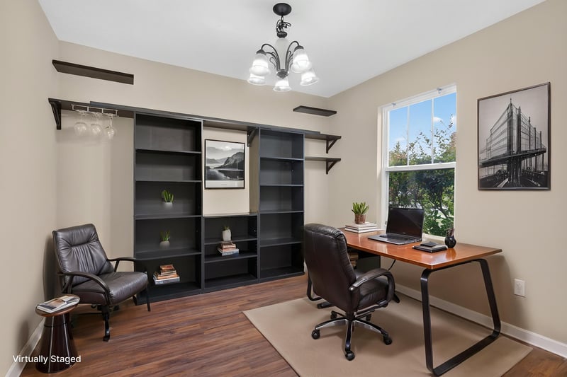 Flex room virtually staged as office with built-in shelving at 7253 Townsend Village Ct, Jacksonville, FL