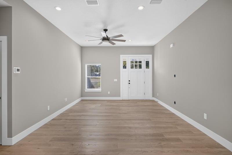 Empty living room with view to front door at 175 Alava Ct