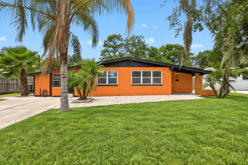Front exterior, palm trees and wide lawn at 4039 Habana Ave, Jacksonville, FL