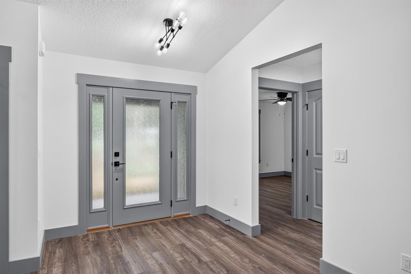 Foyer hallway leading into the open living area at 4800 Acacia St, Middleburg, FL 32068
