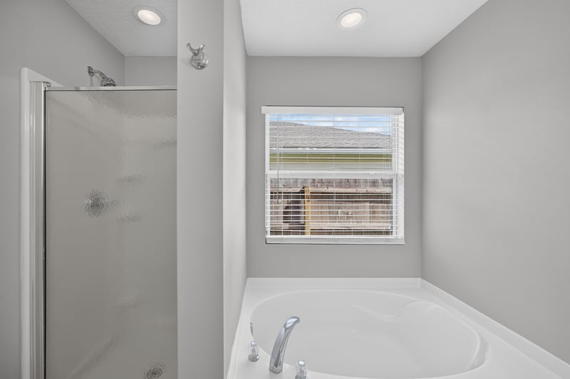 Bathroom with soaking tub and window at 7545 Lirope St, Jacksonville, FL 32244
