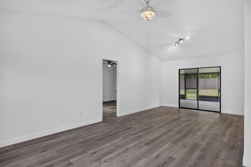 Open living area with vaulted ceiling and doorways at 551 Deltona Blvd, St. Augustine, FL 32086