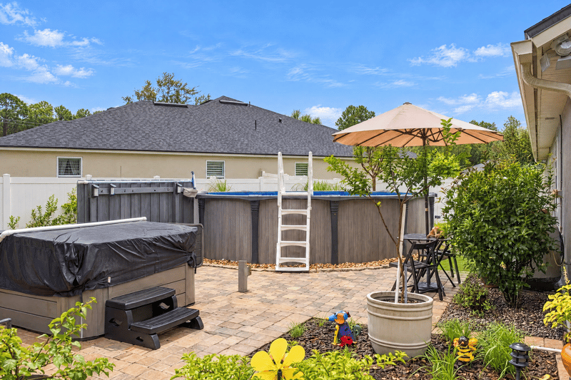 Backyard with hot tub and pool at 10923 Black Diamond Ct, Jacksonville, FL