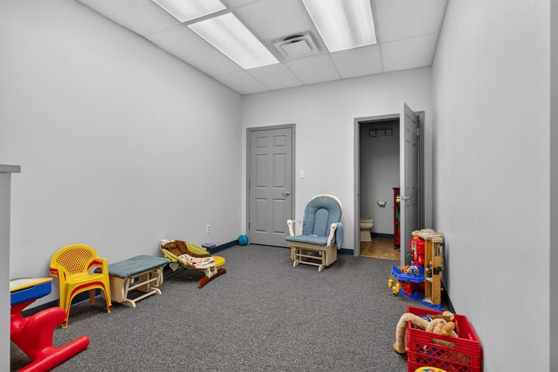 Carpeted room with children's toys and small chairs at 1038 County Rd 315, Melrose