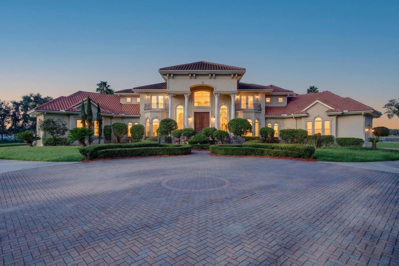 Front exterior at day-to-dusk with illuminated windows at 344 Broward Rd, Jacksonville, FL
