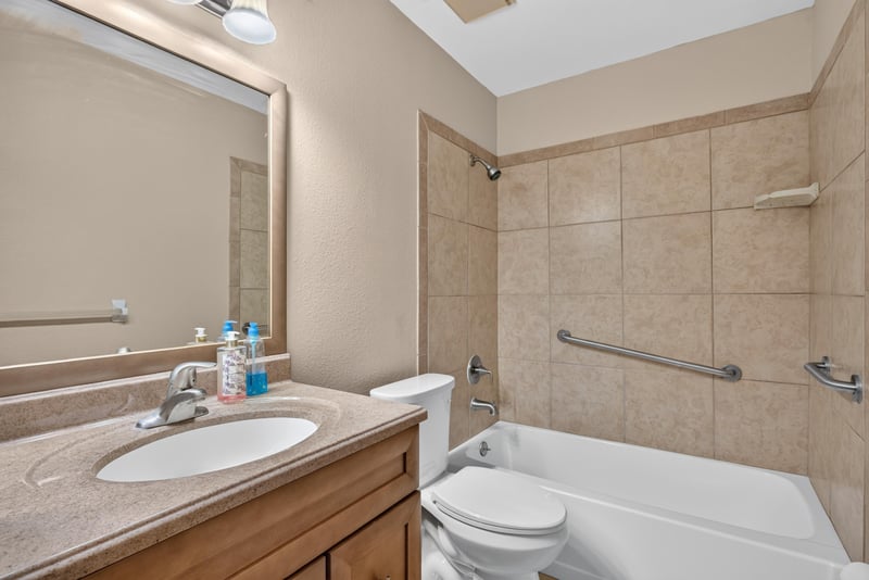 Bathroom with tub-shower combo and grab bars at 3515 Cormorant Branch Ct, Jacksonville, FL