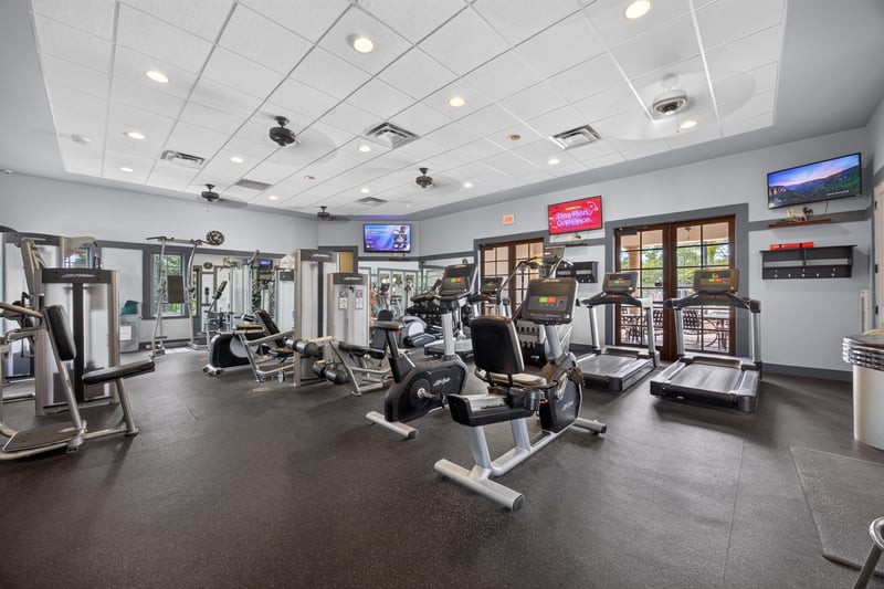 Clubhouse fitness center with weight machines in Murabella