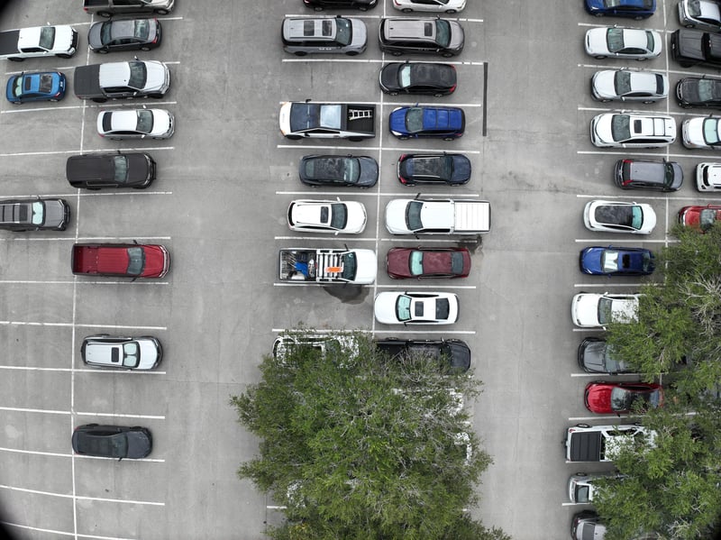 Aerial view of parking lot with scattered cars at 9406 Atlantic Blvd, Jacksonville, FL 32225