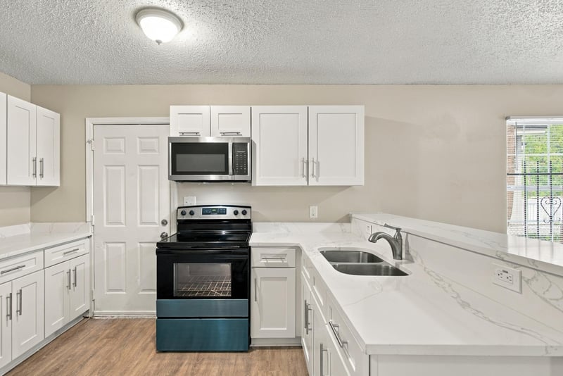 Kitchen counter and sink below window at 219 Shortreed St, Jacksonville, FL 32254