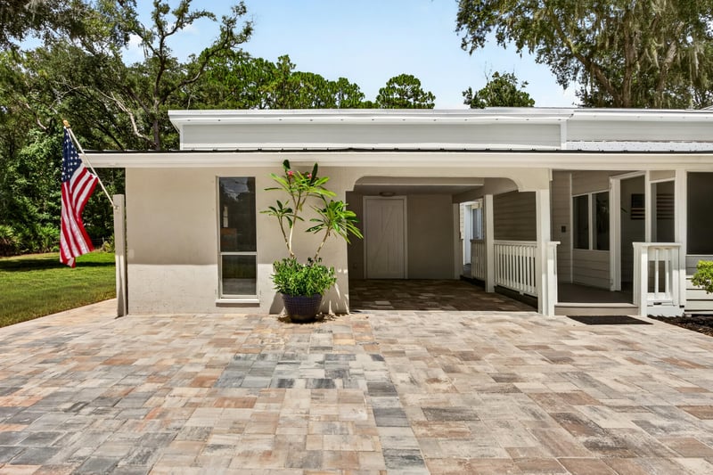 Carport breezeway with brick paver flooring at 1161 Whispering Pines Rd, Jacksonville, FL 32259