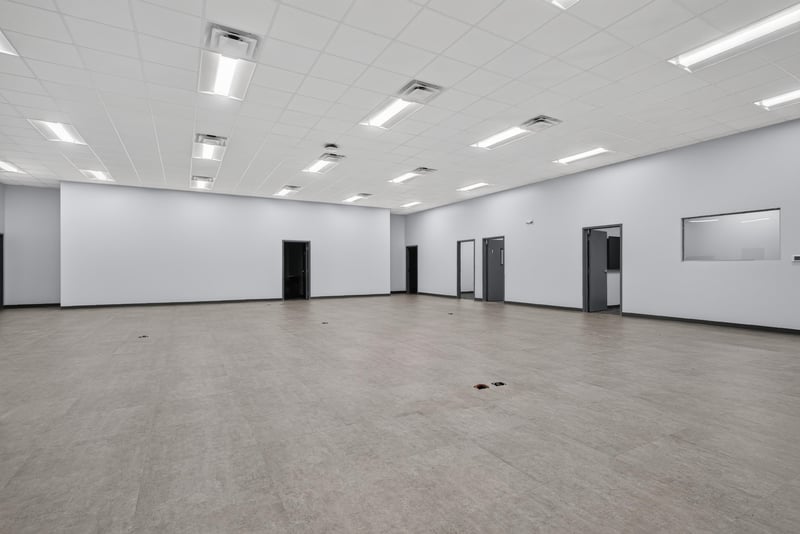 Open space with interior doors and windowed wall at 7240 Golden Wings Rd building 100, Jacksonville, FL 32244