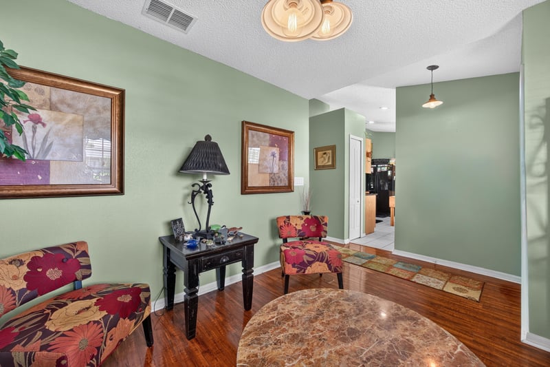 Sitting area with wood floors and round table at 145 Dover Bluff Dr, Orange Park, FL