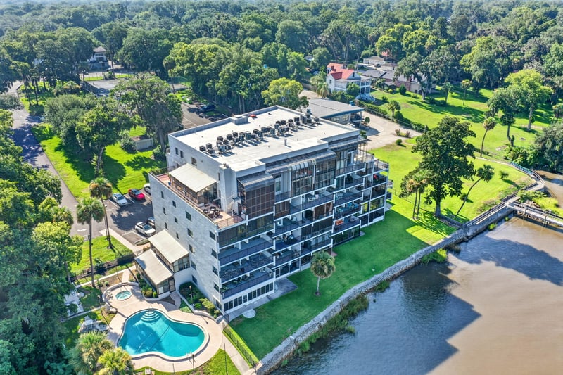Aerial view of condo building with pool in Jacksonville