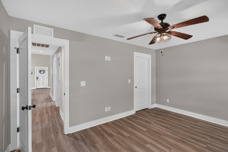 Hallway with doors and ceiling fan at 2855 N 8th St, St. Augustine, FL 32084