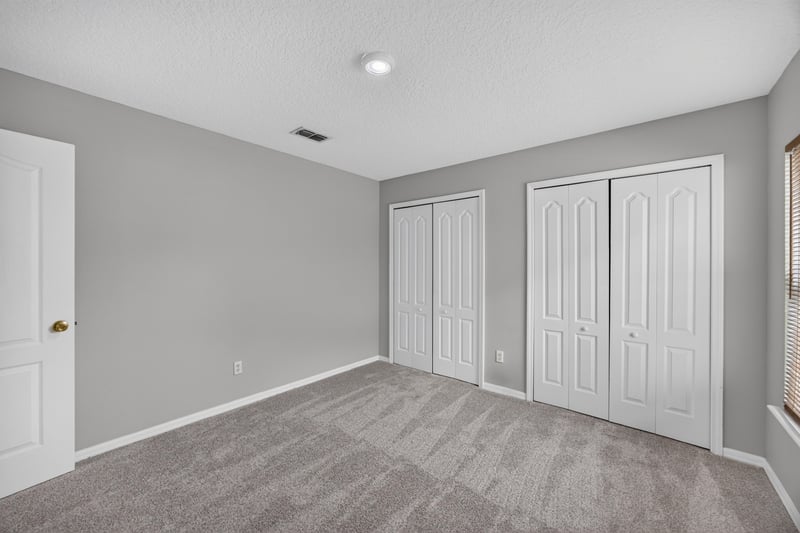 Bedroom closet with double doors at 635 Wakeview Dr, Orange Park, FL 32065
