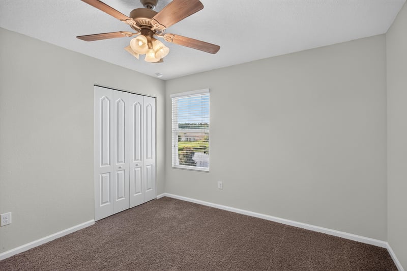 Bedroom with closet and ceiling fan at 6830 Hanford St, Jacksonville, FL 32219