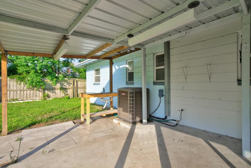 Covered carport area with AC unit at 442 Ameca Ave, Orange Park, FL 32073