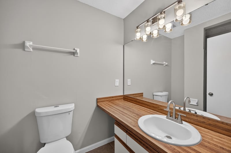 Bathroom with toilet and butcher block vanity at 3801 Crown Point Rd, Jacksonville, FL 32257