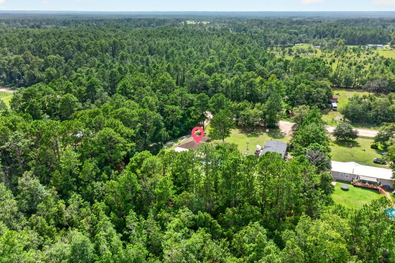 Aerial view of the property marked among trees in Middleburg, FL