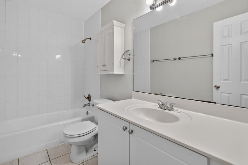 Bathroom vanity and tub at 3866 Campenero Ct unit 6, Jacksonville, FL 32217