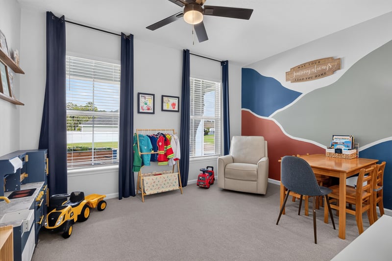 Bedroom with mountain mural and play table at 2354 Jennings Farm Dr, Middleburg, FL 32068