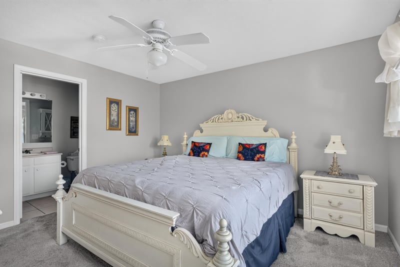 Primary bedroom with bed and ceiling fan at 206 16th St, St. Augustine, FL 32080