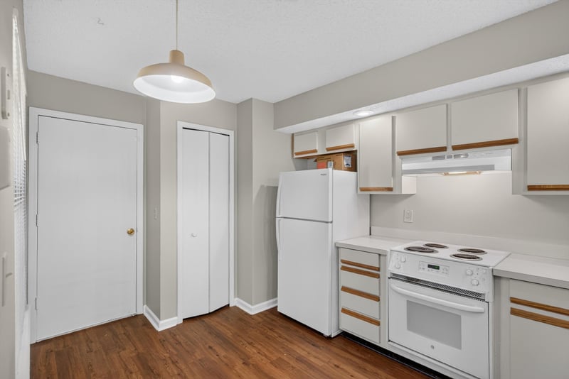 Kitchen with range and cabinetry at 8010 International Village Dr, Jacksonville, FL 32277